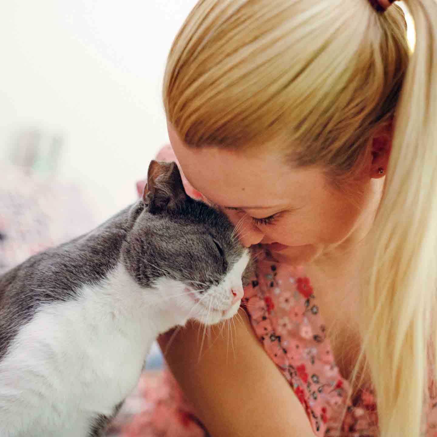woman and cat cuddling